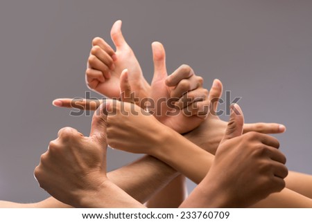 Hands of many people showing thumbs up