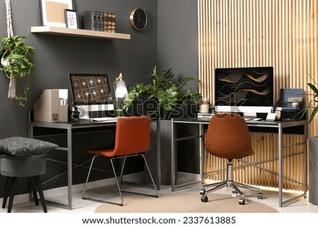 Cozy workspace with computer on metal desk at home