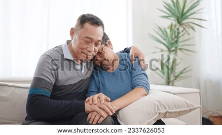 Asian elderly old couple embracing bonding comforting and express empathy. Elderly man caring wife holding hands supporting giving sympathy loving. Couple retirement lifestyle