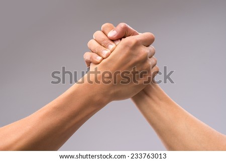 Hands of friends greeting each other