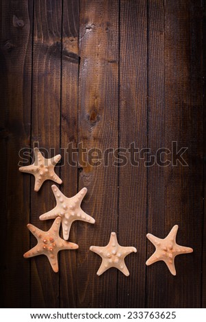 Marine items on wooden background. Sea objects on wooden planks. Selective focus.