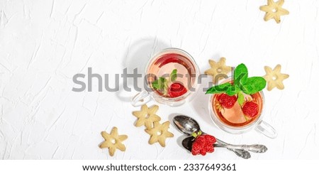 Strawberry tea concept. Good morning concept. Teapot, ripe fruits, healthy beverage. Hard light, dark shadow, white background, banner format
