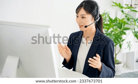 Female operator working in office. Call center. Customer support. Royalty-Free Stock Photo #2337673701