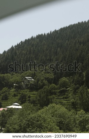 Aerial photography of green mountains, blue sky and white clouds. mountain summer landscape. 