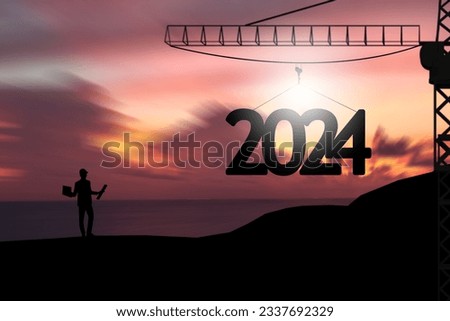 Concept Happy new year Silhouette of engineer and construction to create lifting crane 2024 on sunrise background.
