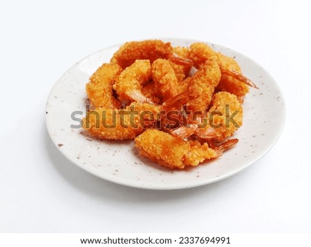 Crispy Breaded Prawns or Ebi Furai Japanese Food or Panko Breaded Deep Fried Shrimp. Served on a white plate and isolated on a white background. Royalty-Free Stock Photo #2337694991