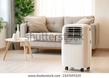 portable air conditioner or mobile air cooler in modern living room Royalty-Free Stock Photo #2337695529