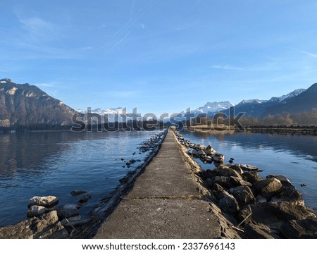 Concrete jetty on Lake Geenva on a sunny Winter day near Villeneuve in Switzerland
