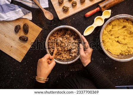 arabic woman hands while preparing ingredients for keto kahk at home Royalty-Free Stock Photo #2337700369