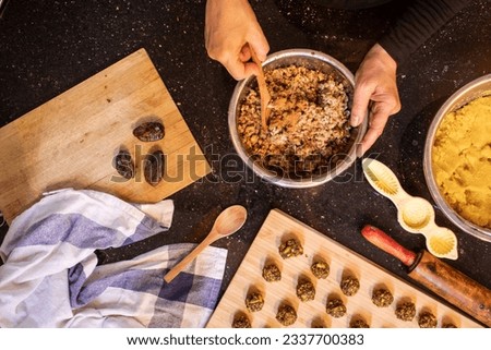 arabic woman hands while preparing ingredients for keto kahk at home Royalty-Free Stock Photo #2337700383