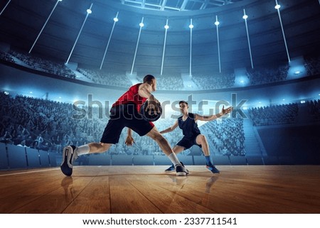 Motivated and competitive young men, basketball players in motion during match, game playing at 3D arena with flashlights. Concept of professional sport, competition, action, hobby, game.