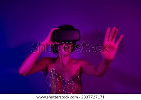 Photo of lady playing simulation game vr box impressed surprise visual effect illusion isolated bright neon color background