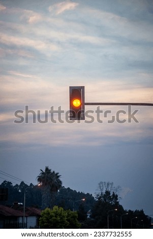 Traffic light in sunset, yellow color, stock photo