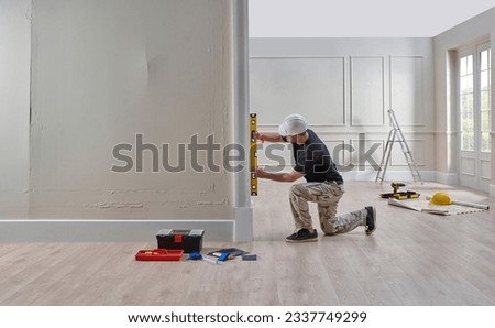 Repair man home style, building house concept, painting, interior architect. Royalty-Free Stock Photo #2337749299
