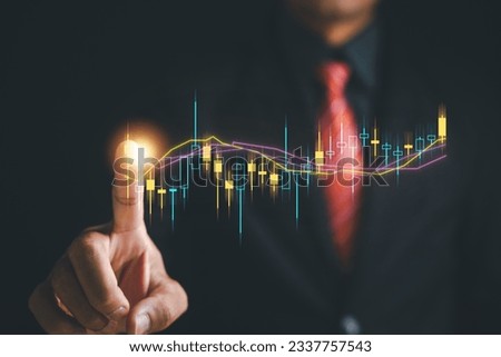 Progress and success in investment planning. Trader hand touches a growing virtual hologram stock on screen, emphasizing potential of stock market trading for achieving financial growth and prosperity