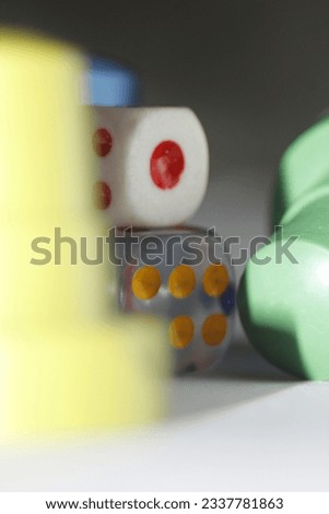 A Picture Of A White Dice On A Transparent Dice With LUdo Pieces  Royalty-Free Stock Photo #2337781863
