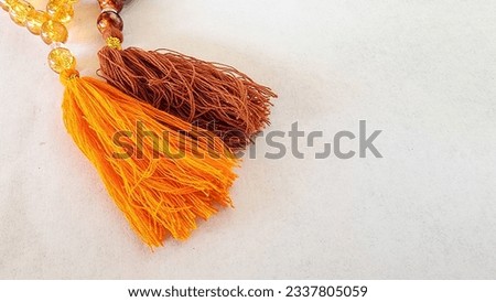 a tasbih bracelet with small size, made of plastic beads, as a tool for praying for Muslims to their god, made in Indonesia Royalty-Free Stock Photo #2337805059
