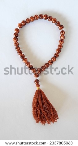 a tasbih bracelet with small size, made of plastic beads, as a tool for praying for Muslims to their god, made in Indonesia Royalty-Free Stock Photo #2337805063
