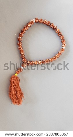 a tasbih bracelet with small size, made of plastic beads, as a tool for praying for Muslims to their god, made in Indonesia Royalty-Free Stock Photo #2337805067
