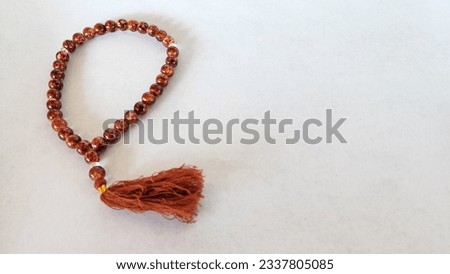 a tasbih bracelet with small size, made of plastic beads, as a tool for praying for Muslims to their god, made in Indonesia Royalty-Free Stock Photo #2337805085