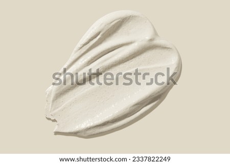 Scrub smear on a beige background. Beauty texture. Sample of a cosmetic product.  Royalty-Free Stock Photo #2337822249