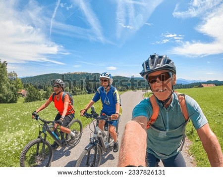 Group of active senior friends having fun during a cycling tour in the Allgau Alps near Oberstaufen, Bavaria, Germany Royalty-Free Stock Photo #2337826131