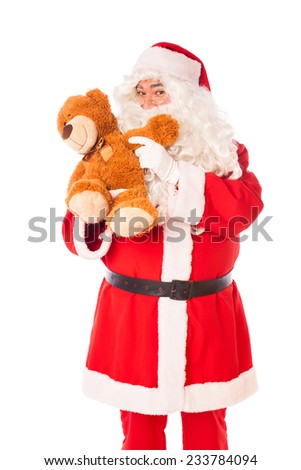 santa claus playing with a teddy bear, on white 