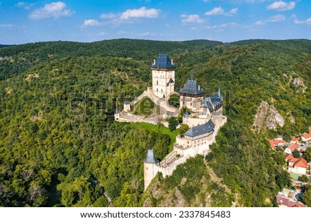 Royal Castle Karlstejn. Central Bohemia, Karlstejn village, Czechia. Aerial view to The Karlstejn castle. Royal palace founded King Charles IV. Amazing gothic monument in Czech Republic, Europe.