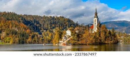 Panoramic banner of Lake Bled with Church, Slovenia and autumn colorful trees background