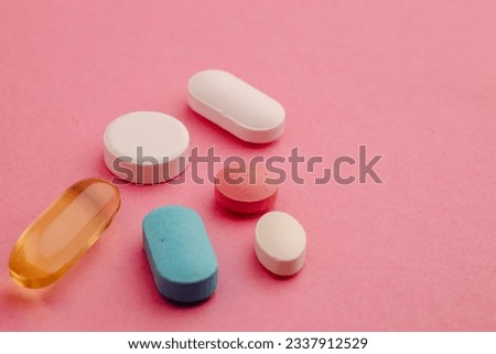 Pharmaceutical medicine pills, tablets and capsules on mint background. Top view. Flat lay. Copy space. Medicine concepts. Minimalistic abstract concept.