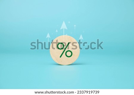 Wooden block with signs and symbols of percentage and arrow up, Financial and business growth interest rates, Business growth, Property and real estate business investment, Asset management