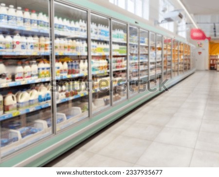 Choosing a dairy products at supermarket.Grocery stores .blurred background Royalty-Free Stock Photo #2337935677