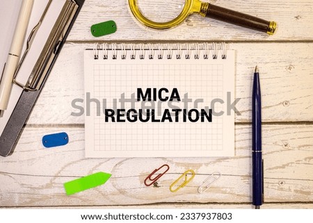 MiCA or Markets in Crypto Assets concept. Stacked cryptocurrency coins and wooden blocks with text. Copy space Royalty-Free Stock Photo #2337937803