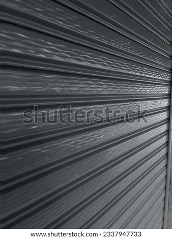 Iron or stainless rolling door reflect with lighter