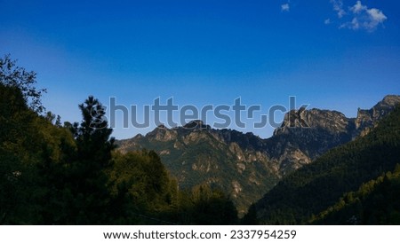 Italian Landscape: Mountain landscape in summer. Above 1000 meters asl. "Valtorta natural area". Bergamo province, Italy. Alpine meadows, forests and paths, surrounded by Prealpine and Alpine peaks