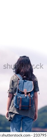 Asian,Portrait of backpacker with a rucksack standing on the mountain hill while enjoying nature scenery view in summer holidays 