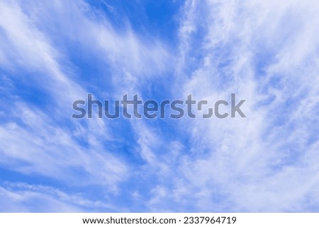 Cirrus clouds like brooms in the blue sky Royalty-Free Stock Photo #2337964719