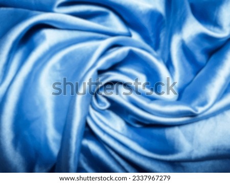 Blur photo, texture, background, pattern, blue silk. Abstract background of elegant blue fabric or liquid wave or wavy grunge texture.  all background