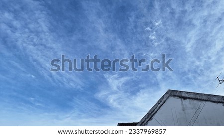 Captivating cityscape with modern architecture and clear blue sky. High-rise building exterior.