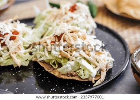 mexican tostadas with chicken, cooking traditional homemade food in Mexico Latin America