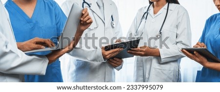 Medical staff team with doctor nurse and healthcare specialist professions working together with laptop and tablet in hospital. Medical workplace and healthcare community in panoramic banner. Neoteric