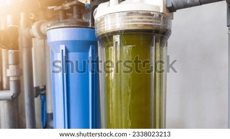 Close up a dirty water filter catridge  that needs to be replaced with a new one. Royalty-Free Stock Photo #2338023213