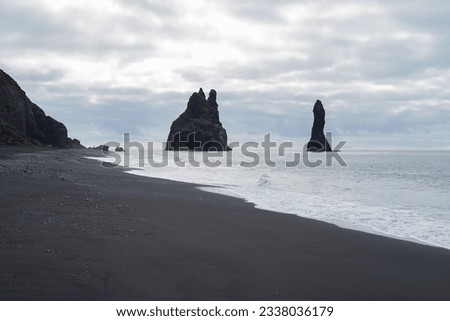 Black Sand Beach Reynisfjara in Iceland. Royalty-Free Stock Photo #2338036179