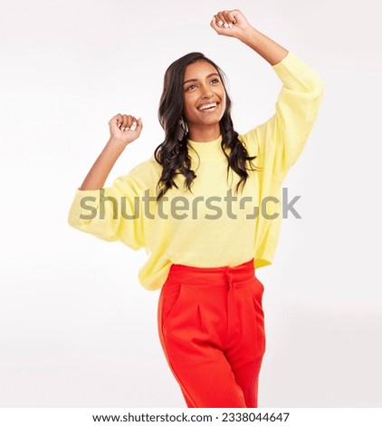 Indian woman, dance and happy with fashion in studio with white background for beauty, cosmetics or happiness on face. Celebration, smile and excited person with fun energy or style of trendy clothes