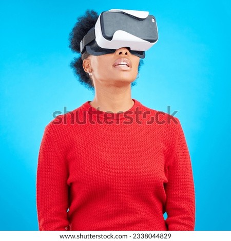 VR, metaverse and digital glasses with woman watching a video with augmented reality. Studio, female person and blue background with future technology and online web user with 3d virtual network