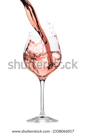 rose wine splashing on white background Royalty-Free Stock Photo #2338066017