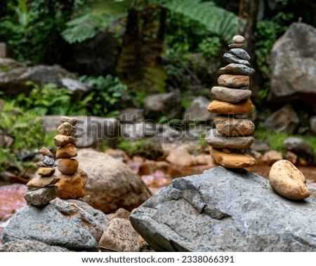 stacked stones, zen, soothing on a waterfall background - PHILIPPINES - VG