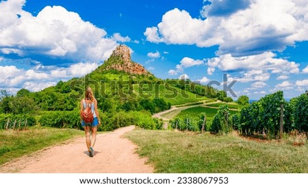 Woman tourist walking to Solutre Rock- Burgundy in France Royalty-Free Stock Photo #2338067953
