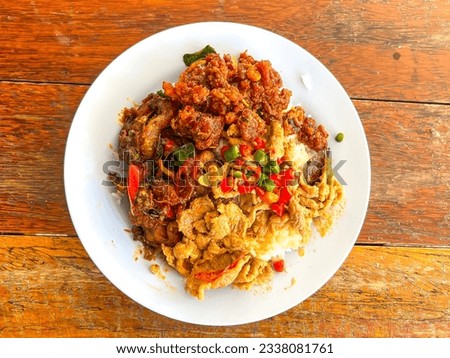 The concept of economic dish meal as curry and rice in Thai's style canteen. Normally, people go to eat in canteen or cafeteria and get rice with various kinds of curry and food. Royalty-Free Stock Photo #2338081761