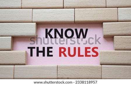 Know the rules symbol. Wooden blocks with words Know the rules. Beautiful pink background. Business and Know the rules concept. Copy space. v
